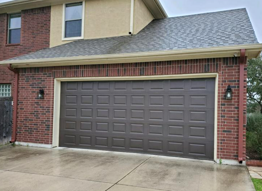 Local garage door repair technician in Florida fixing a residential garage door with professional tools, showcasing reliable neighborhood services.