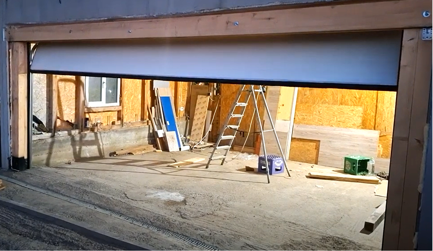 A professional team performing a garage door section replacement at a local residence in Florida, using specialized tools and equipment for efficient and safe service