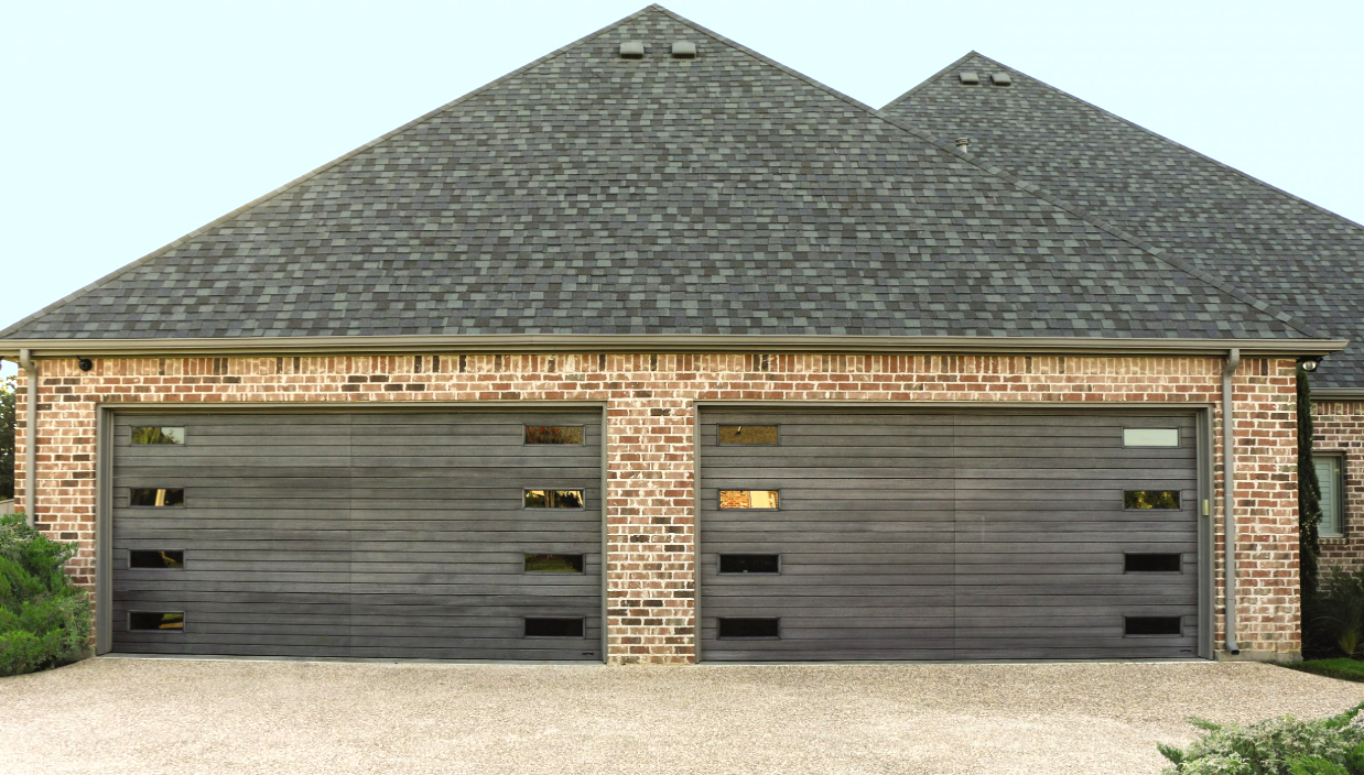 Local garage door service team in FL performing a residential garage door repair, demonstrating expertise and quality service.