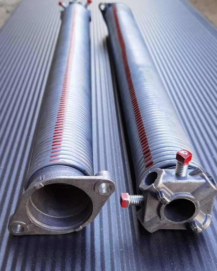 a photo of 2 garage door springs.