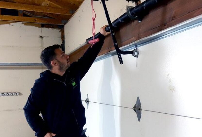 Professional technician performing garage door spring repair for optimal safety and functionality - Local Garage Door Services FL.