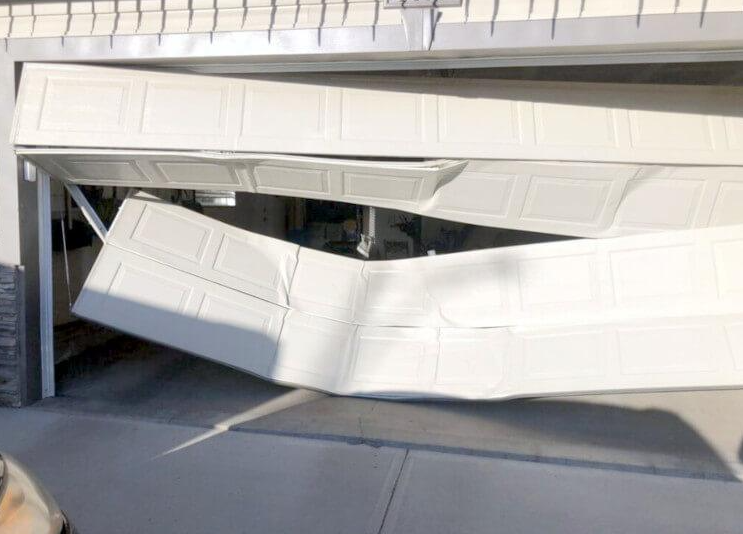 Emergency garage door off-track repair and roller realignment service in Davie FL